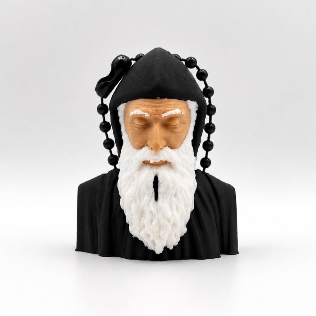 Front view of the Saint Charbel key ring with a white beard, black hood and ball chain