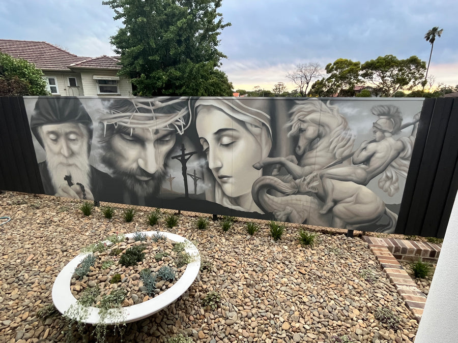 Faith-inspired portrait mural in a residential garden