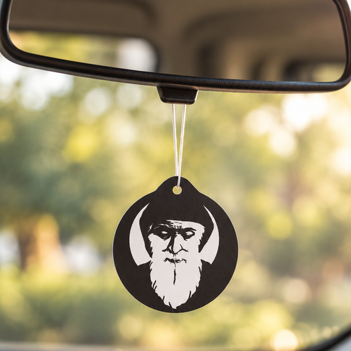 Saint Charbel car air freshener hanging from rear-view mirror